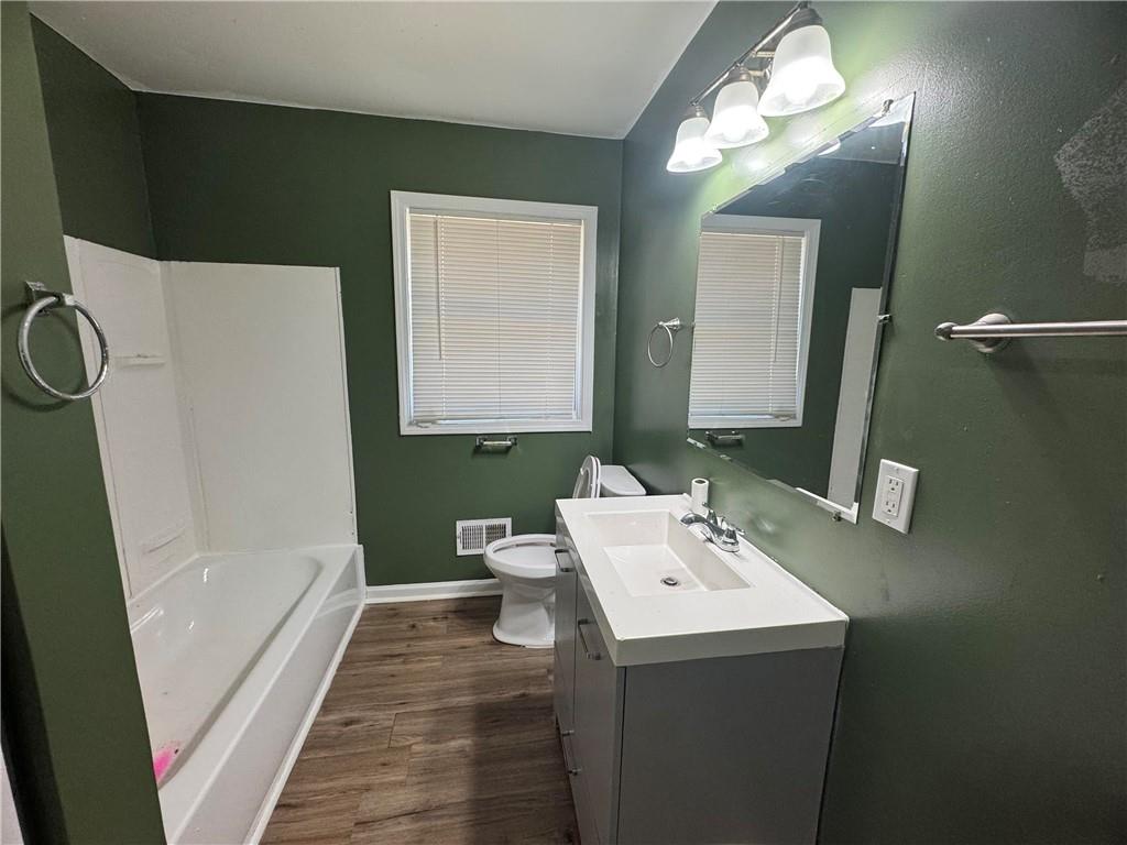 2536 Butner Road Atlanta, GA 30331 - Photo 14 of 19 a bathroom with a sink a toilet and shower