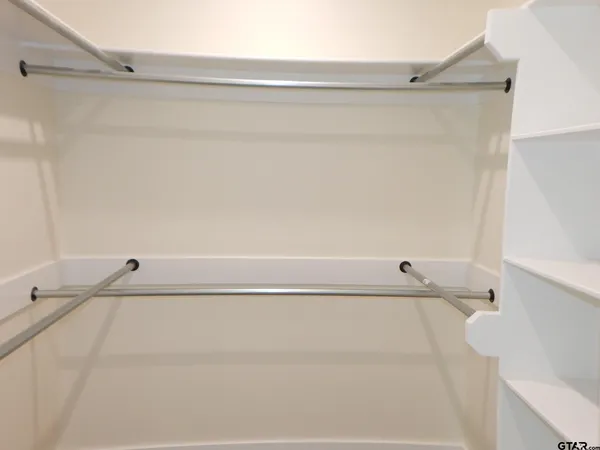 a bathroom with a shower and a sink