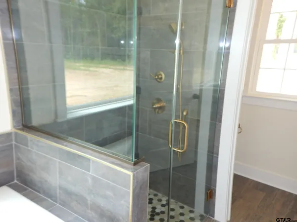 a view of room with window and front door