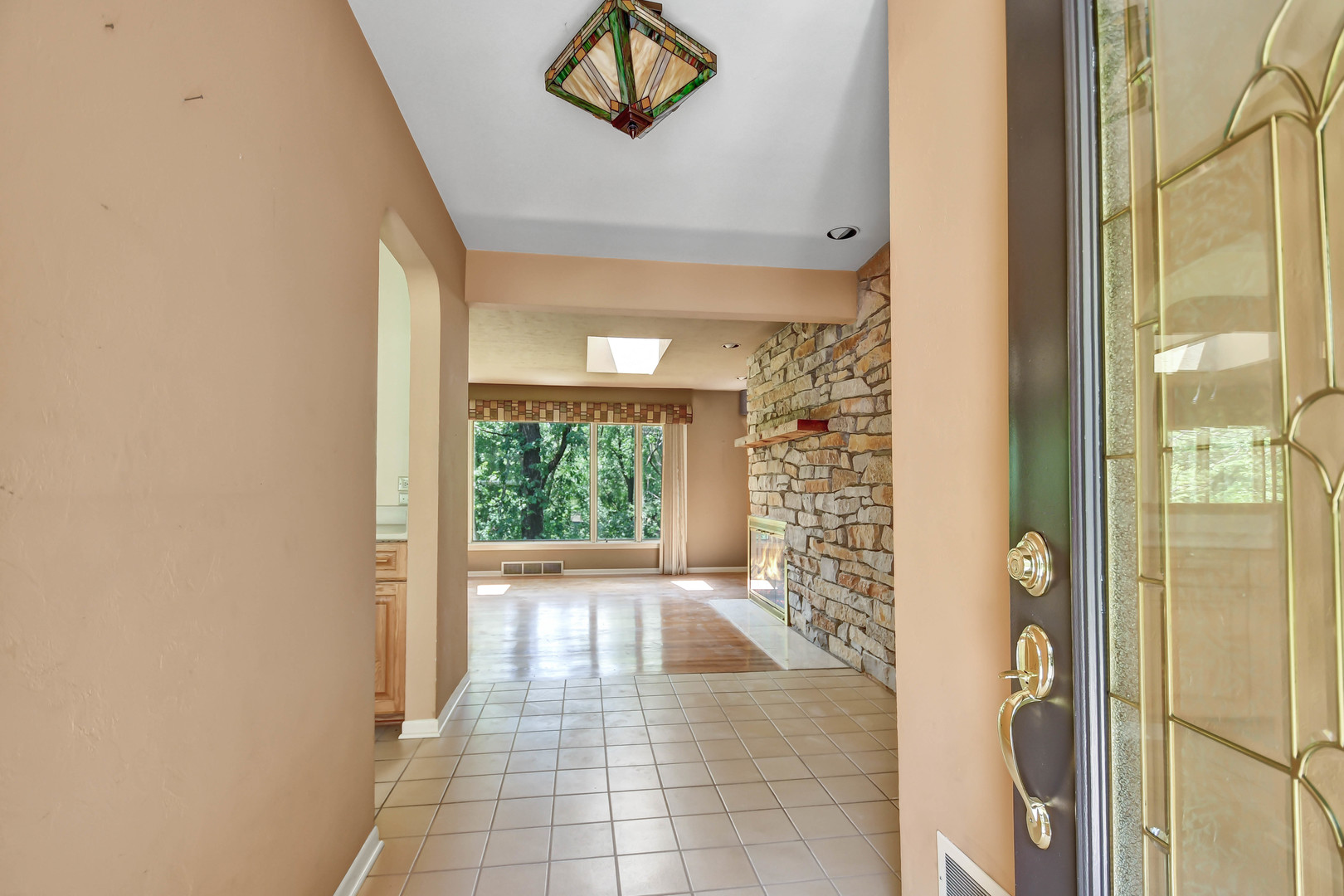12320 South Ridge Avenue Palos Park, IL 60464 - Photo 2 of 33 a view of a hallway with wooden floor and a bathroom
