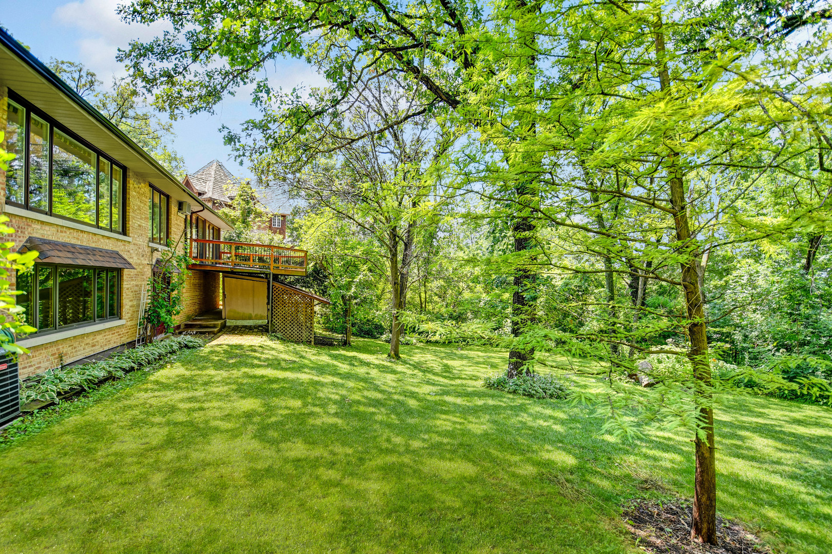 12320 South Ridge Avenue Palos Park, IL 60464 - Photo 32 of 33 a yellow house in middle of the forest