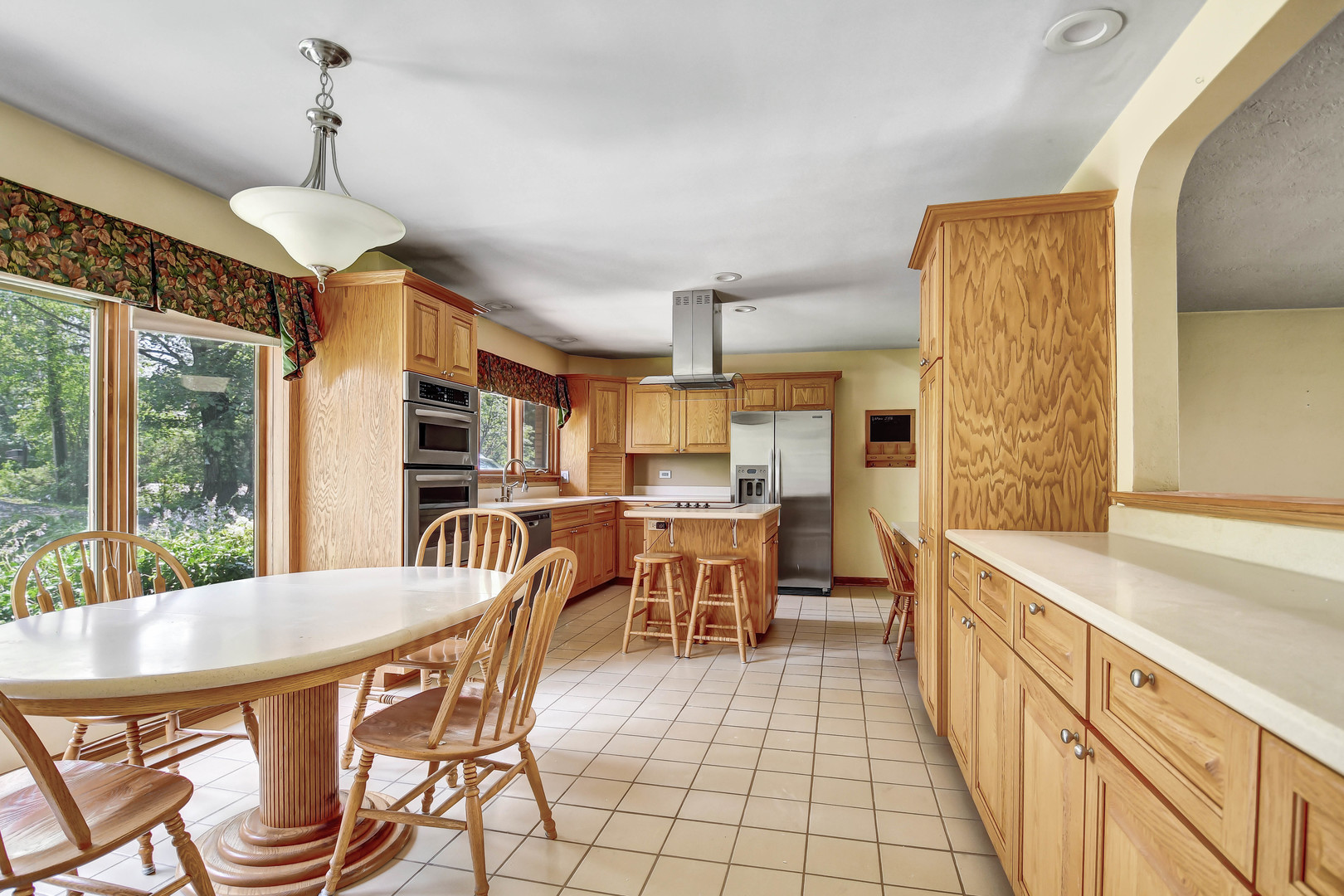 12320 South Ridge Avenue Palos Park, IL 60464 - Photo 7 of 33 a view of a dining room with furniture window and outside view