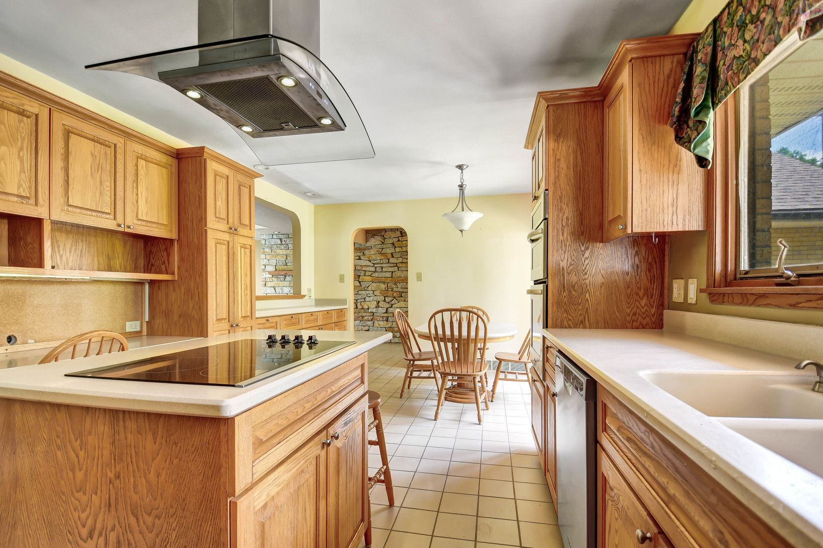 12320 South Ridge Avenue Palos Park, IL 60464 - Photo 10 of 33 a kitchen with a sink and a stove top oven