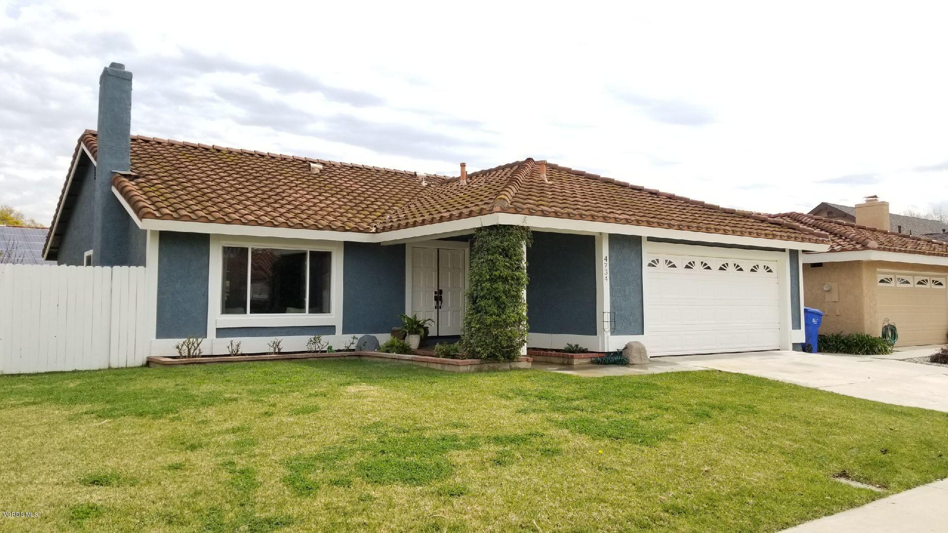 4734 Avedon Road Moorpark, CA 93021 - Photo 1 of 28 a front view of a house with a garden and yard