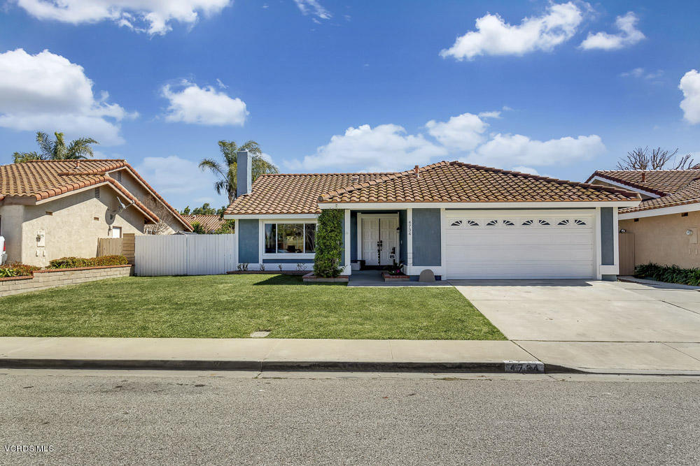 4734 Avedon Road Moorpark, CA 93021 - Photo 2 of 28 a front view of a house with a garden and yard