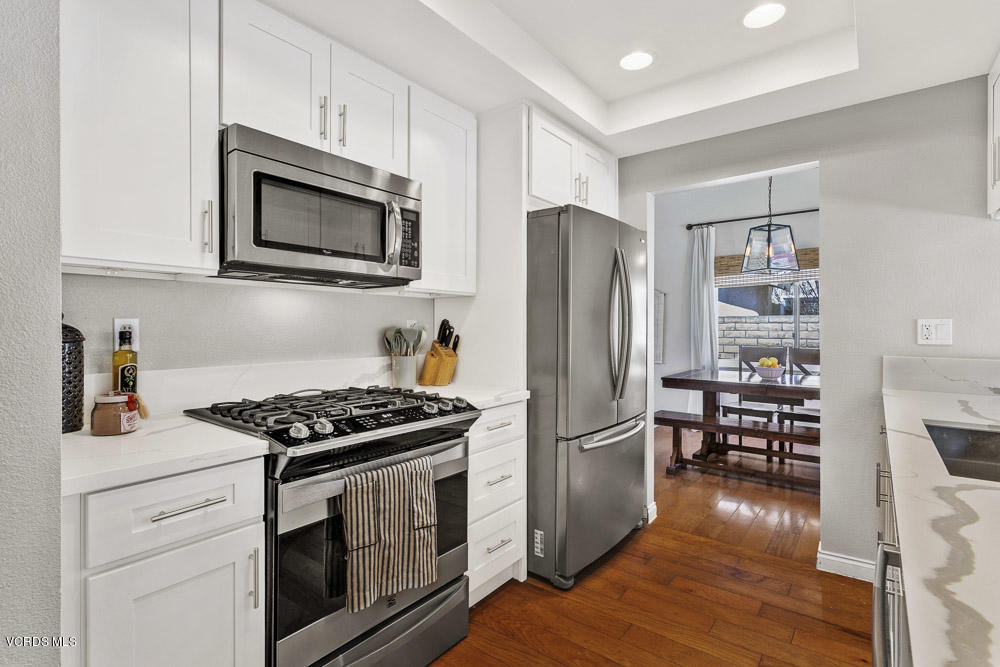 4734 Avedon Road Moorpark, CA 93021 - Photo 16 of 28 a kitchen with stainless steel appliances a stove microwave and refrigerator