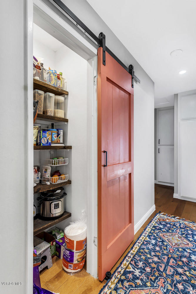 4734 Avedon Road Moorpark, CA 93021 - Photo 18 of 28 a view of walk in closet with clothes and shoes