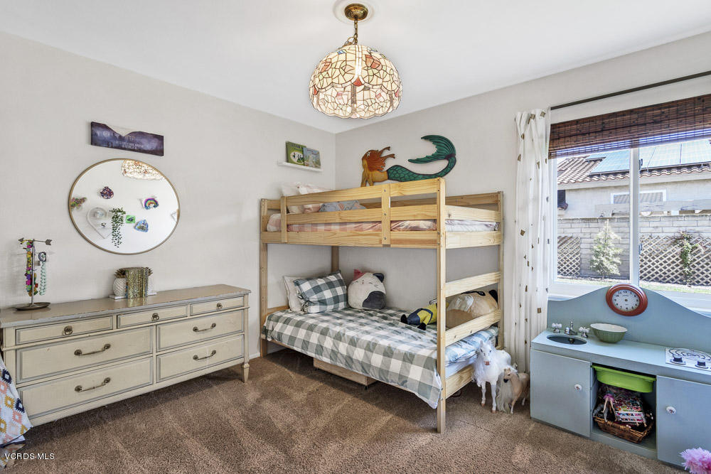 4734 Avedon Road Moorpark, CA 93021 - Photo 20 of 28 a bedroom with a bed and a window