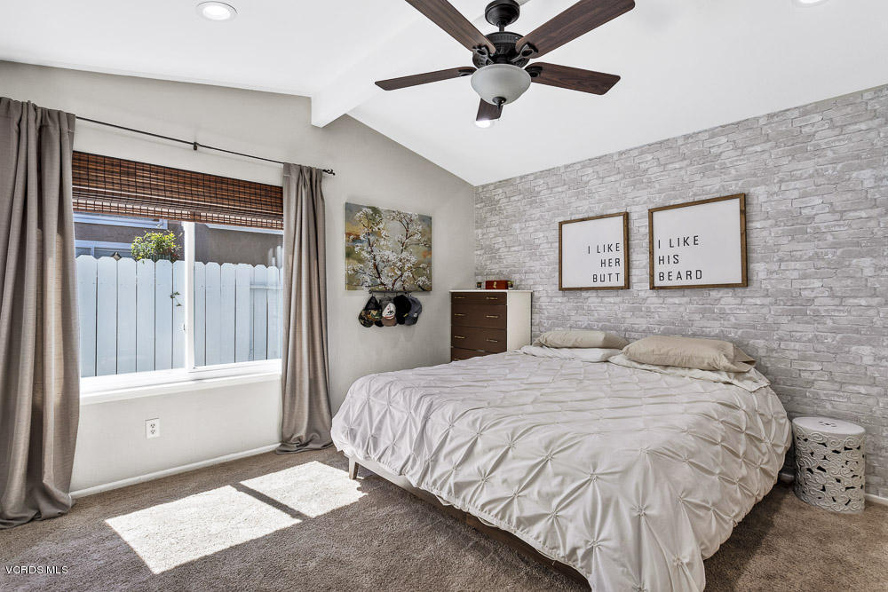 4734 Avedon Road Moorpark, CA 93021 - Photo 22 of 28 a bedroom with a large bed and a ceiling fan