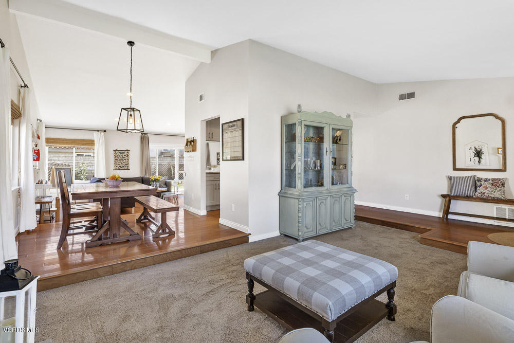 4734 Avedon Road Moorpark, CA 93021 - Photo 9 of 28 a living room with furniture and a dining table with wooden floor