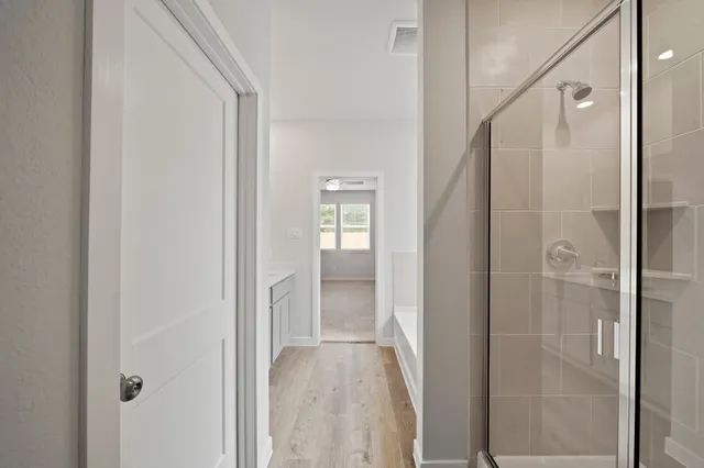 a view of a bathroom from a hallway