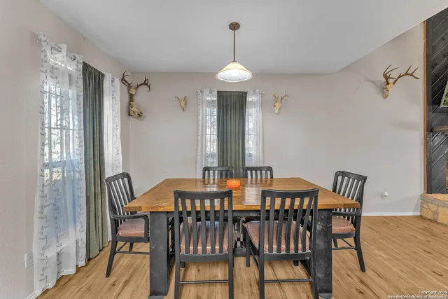 a view of a dining room with furniture window and wooden floor