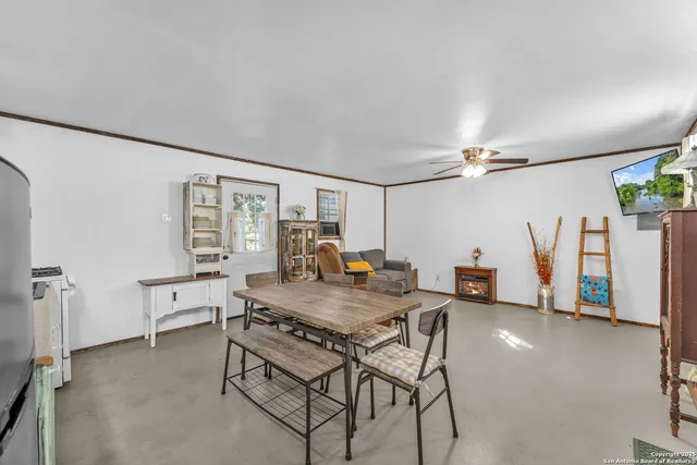 a dining room with furniture and window