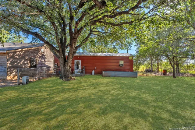 a backyard of a house with lots of green space