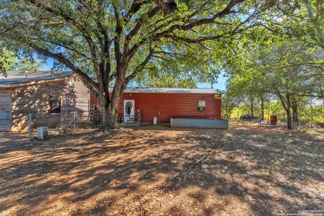 a backyard of a house with lots of green space