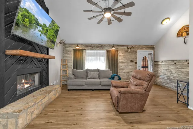 a living room with furniture and a fireplace