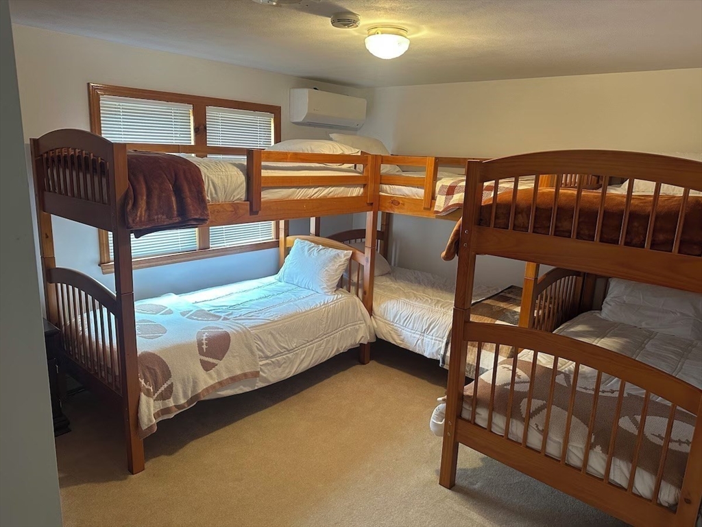 427 Silver Street Middleton, NH 03887 - Photo 13 of 40 a bedroom with furniture and a window