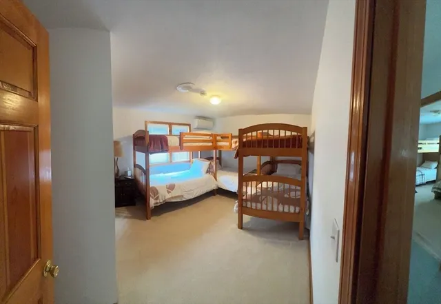 a bedroom with bed and window