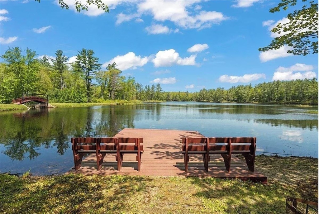 427 Silver Street Middleton, NH 03887 - Photo 2 of 40 a lake view with a table and chairs