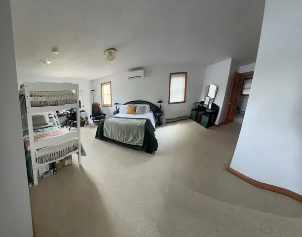 a living room with furniture and a lamp