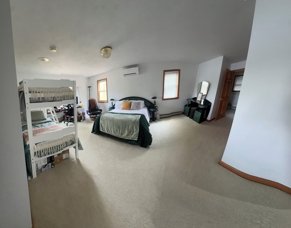 427 Silver Street Middleton, NH 03887 - Photo 22 of 40 a living room with furniture and a lamp