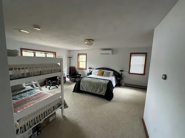 a bedroom with furniture and a fireplace