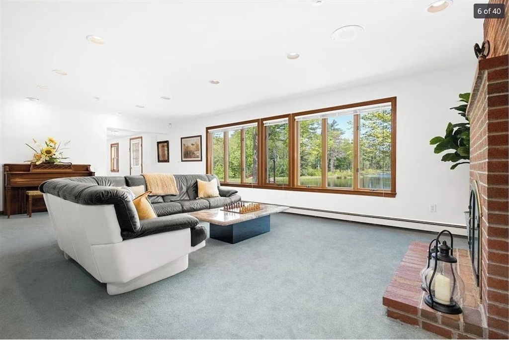 427 Silver Street Middleton, NH 03887 - Photo 26 of 40 a living room with furniture and a large window