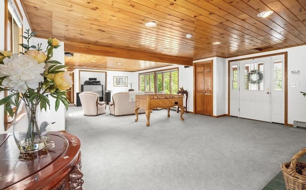 427 Silver Street Middleton, NH 03887 - Photo 31 of 40 a living room with furniture and a large window