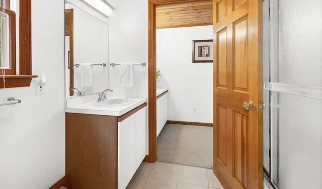 a bathroom with a sink and a mirror