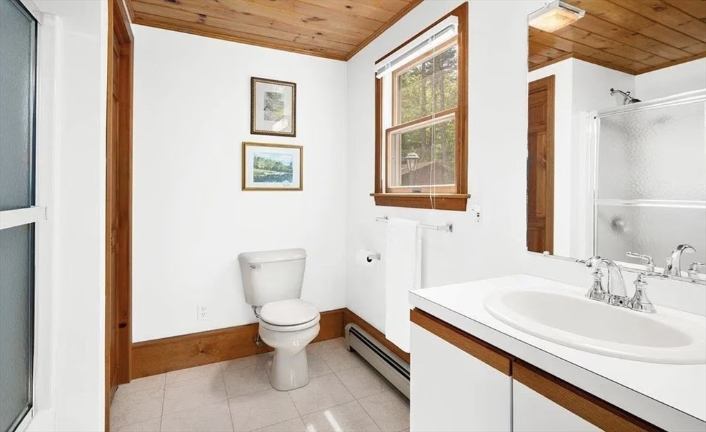 427 Silver Street Middleton, NH 03887 - Photo 38 of 40 a bathroom with a sink and a toilet