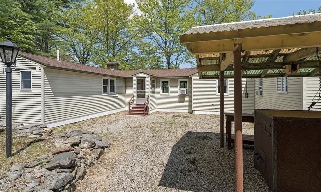 427 Silver Street Middleton, NH 03887 - Photo 40 of 40 a view of a house with a yard
