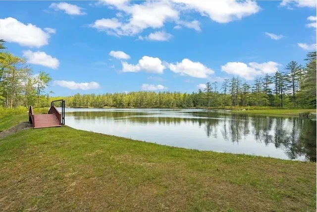 a view of a lake in front of the house
