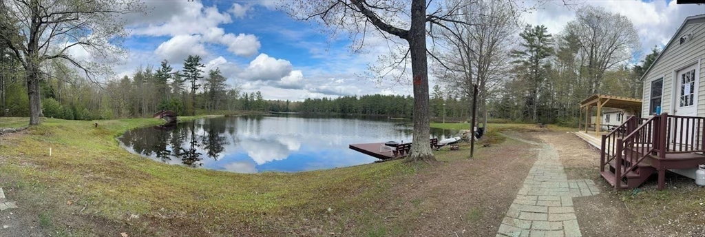 427 Silver Street Middleton, NH 03887 - Photo 7 of 40 a view of a lake with a slide and a tree
