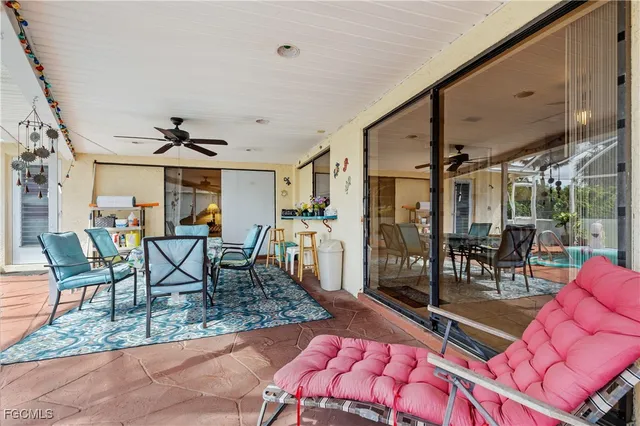 a dining room with wooden floor a table and chairs
