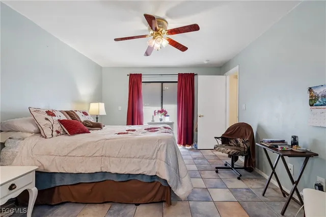 a bedroom with a bed and a chair