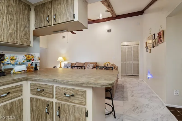 a kitchen with stainless steel appliances granite countertop a sink and cabinets