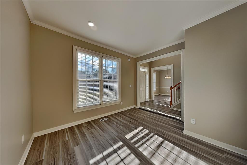 149 Crestview Drive Dallas, GA 30157 - Photo 19 of 24 a view of an empty room with wooden floor and a window