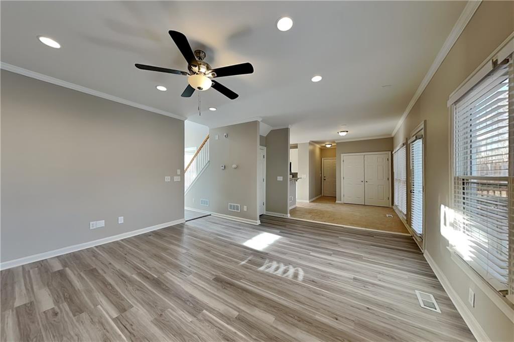 149 Crestview Drive Dallas, GA 30157 - Photo 2 of 24 a view of an empty room and window and wooden floor
