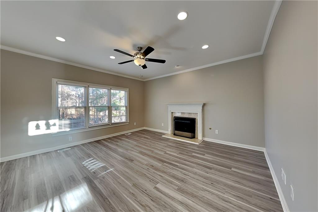 149 Crestview Drive Dallas, GA 30157 - Photo 3 of 24 a view of an empty room with wooden floor and a window