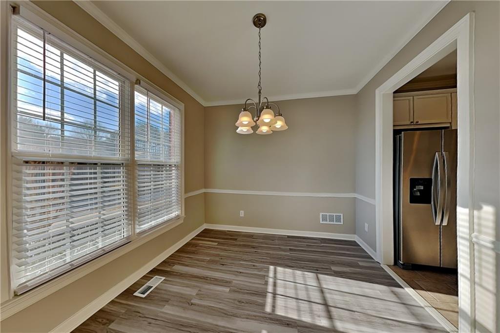 149 Crestview Drive Dallas, GA 30157 - Photo 6 of 24 a view of a livingroom with wooden floor and a large window