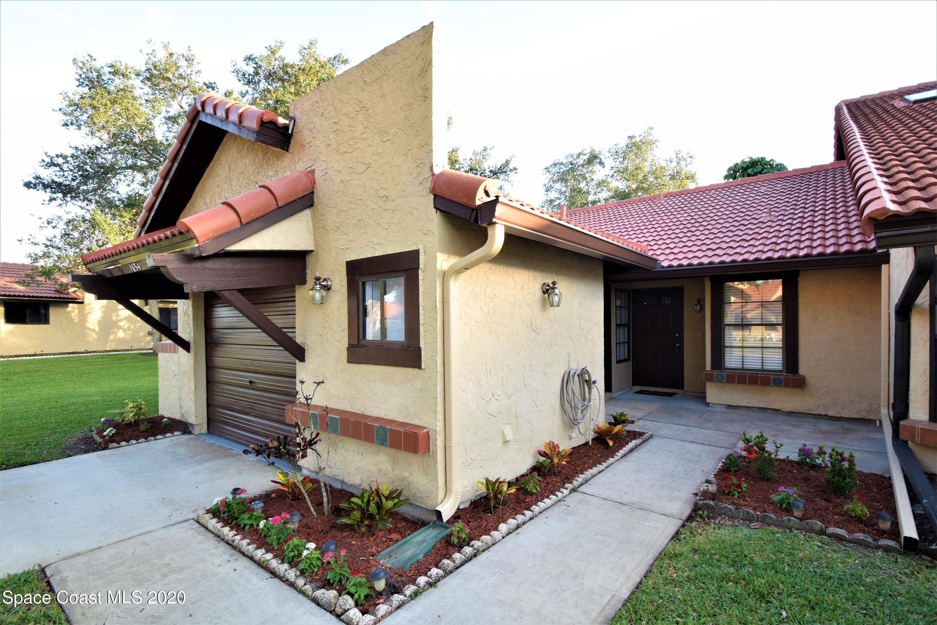 1654 Dawes Road Northeast Palm Bay, FL 32905 - Photo 2 of 47 a view of a house with backyard and garden