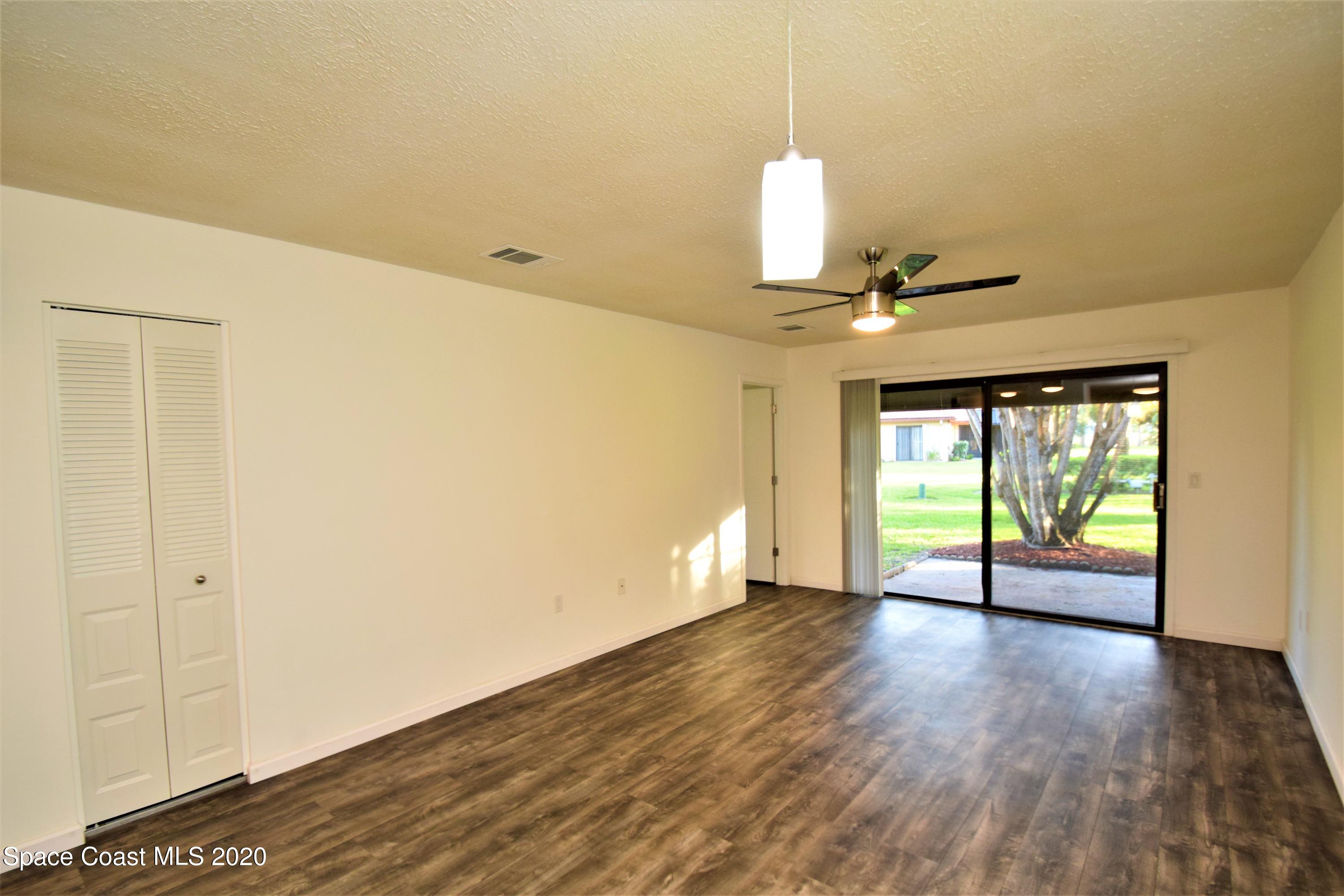 1654 Dawes Road Northeast Palm Bay, FL 32905 - Photo 16 of 47 a view of an empty room with a window
