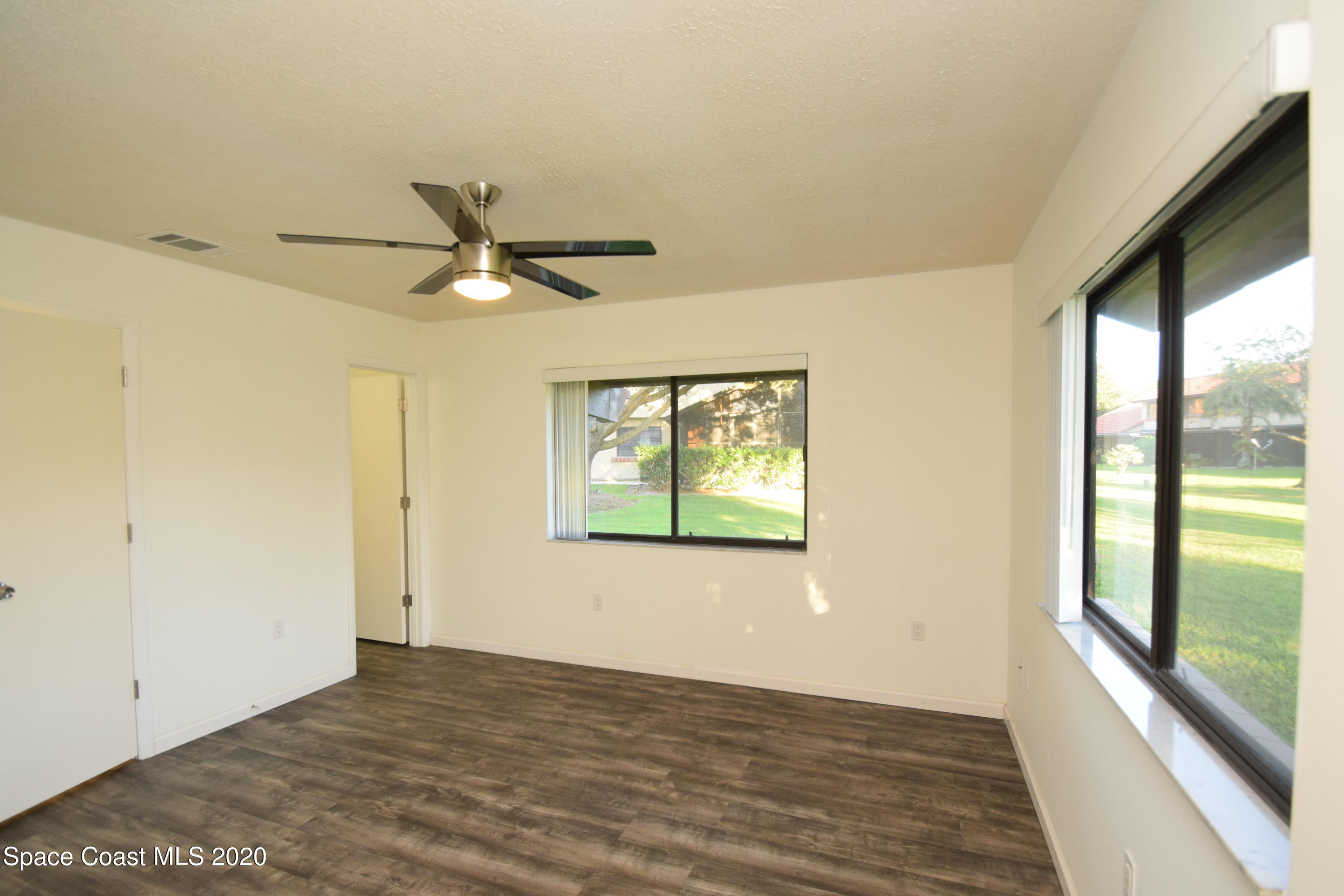 1654 Dawes Road Northeast Palm Bay, FL 32905 - Photo 24 of 47 a view of an empty room and window