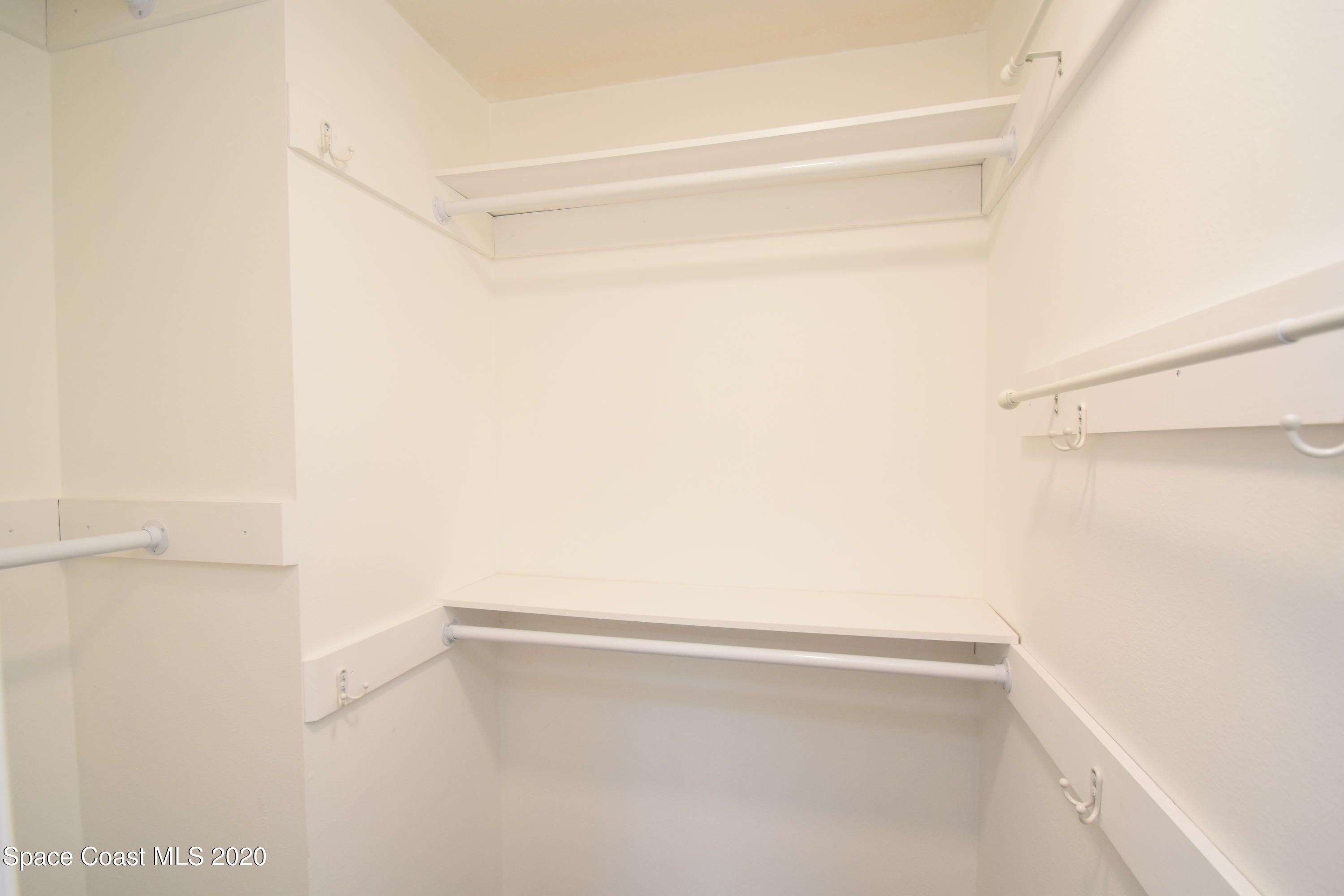 1654 Dawes Road Northeast Palm Bay, FL 32905 - Photo 26 of 47 a view of an empty walk in closet
