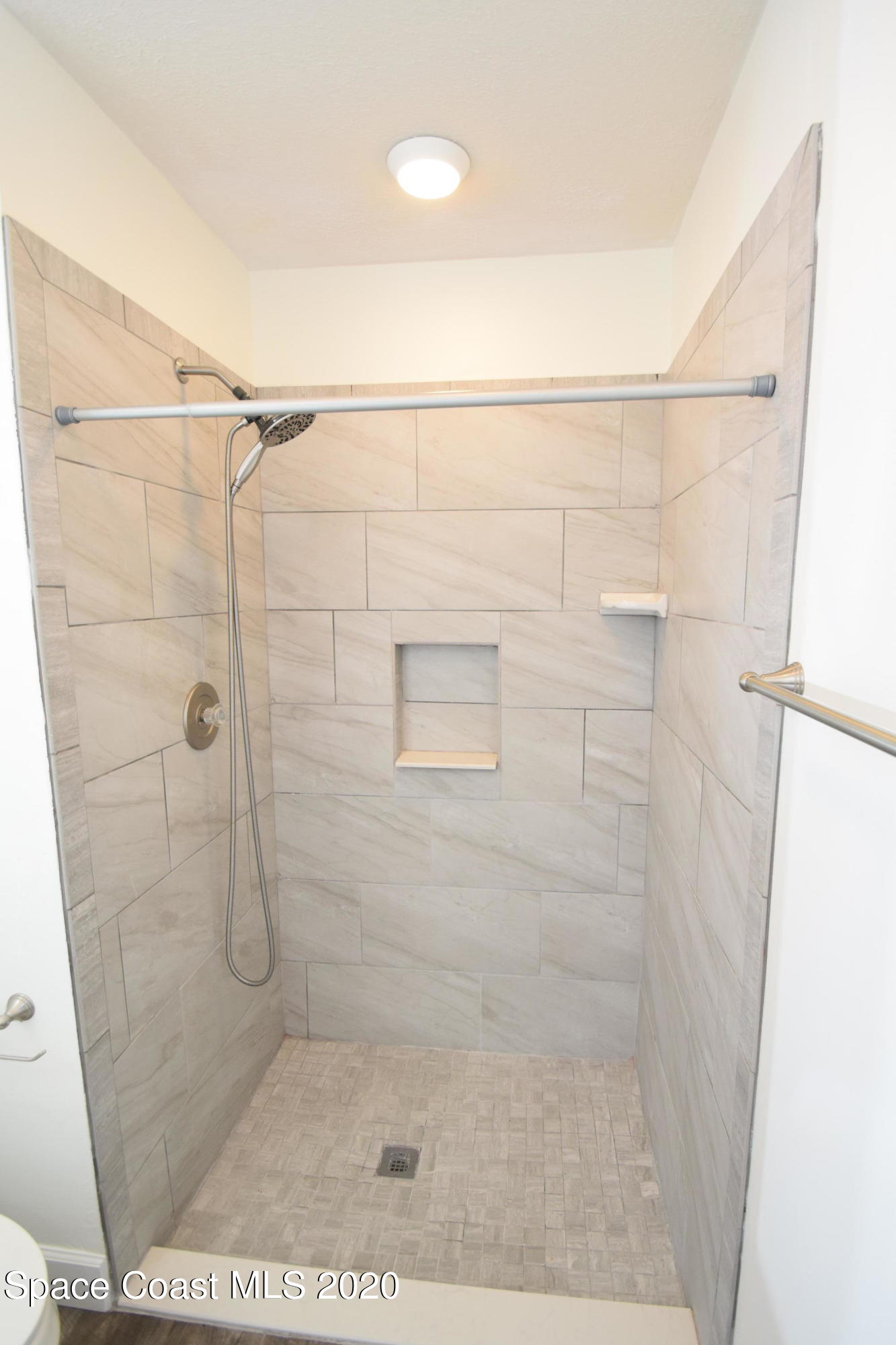 1654 Dawes Road Northeast Palm Bay, FL 32905 - Photo 29 of 47 a bathroom with a shower