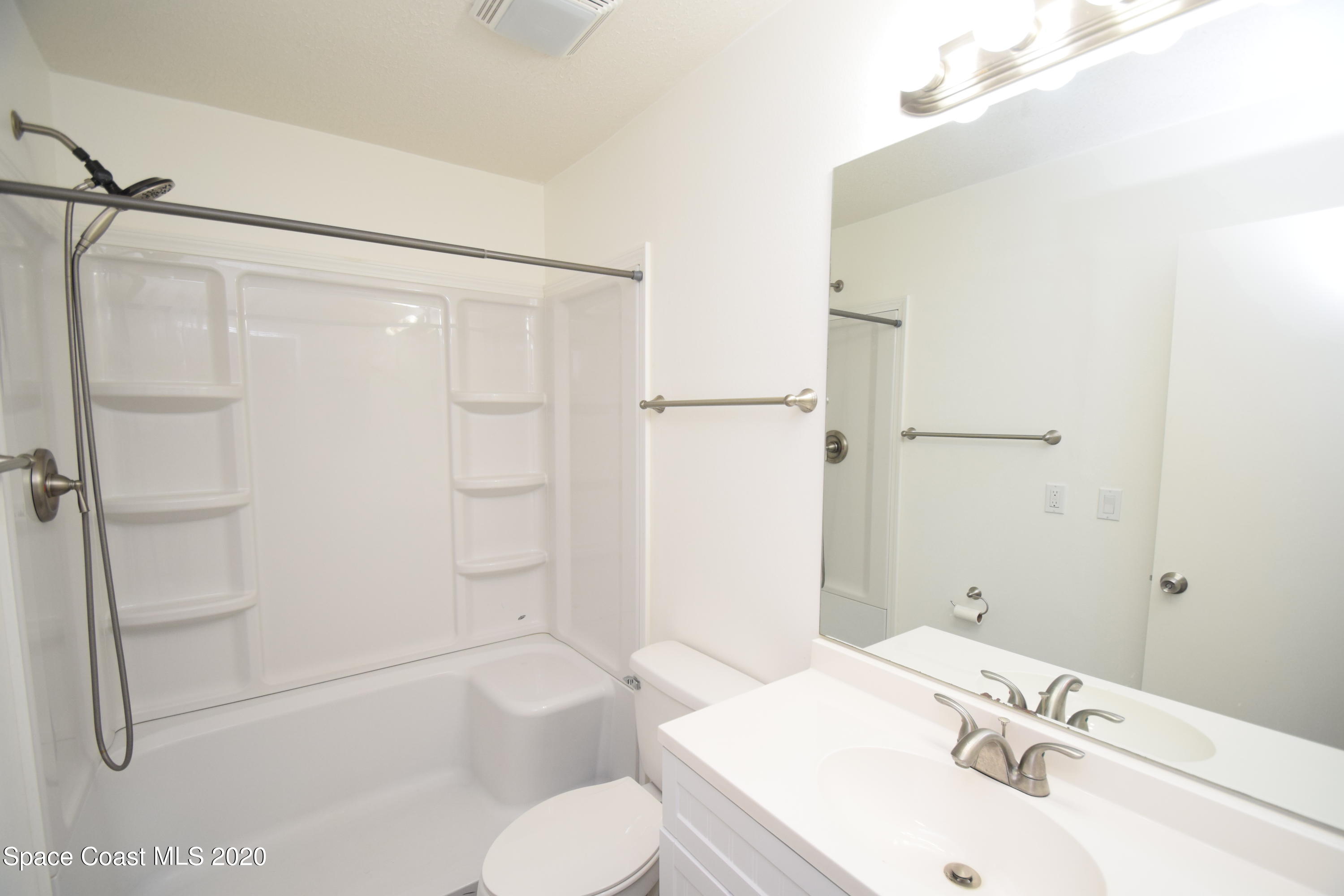 1654 Dawes Road Northeast Palm Bay, FL 32905 - Photo 33 of 47 a bathroom with a sink toilet and shower