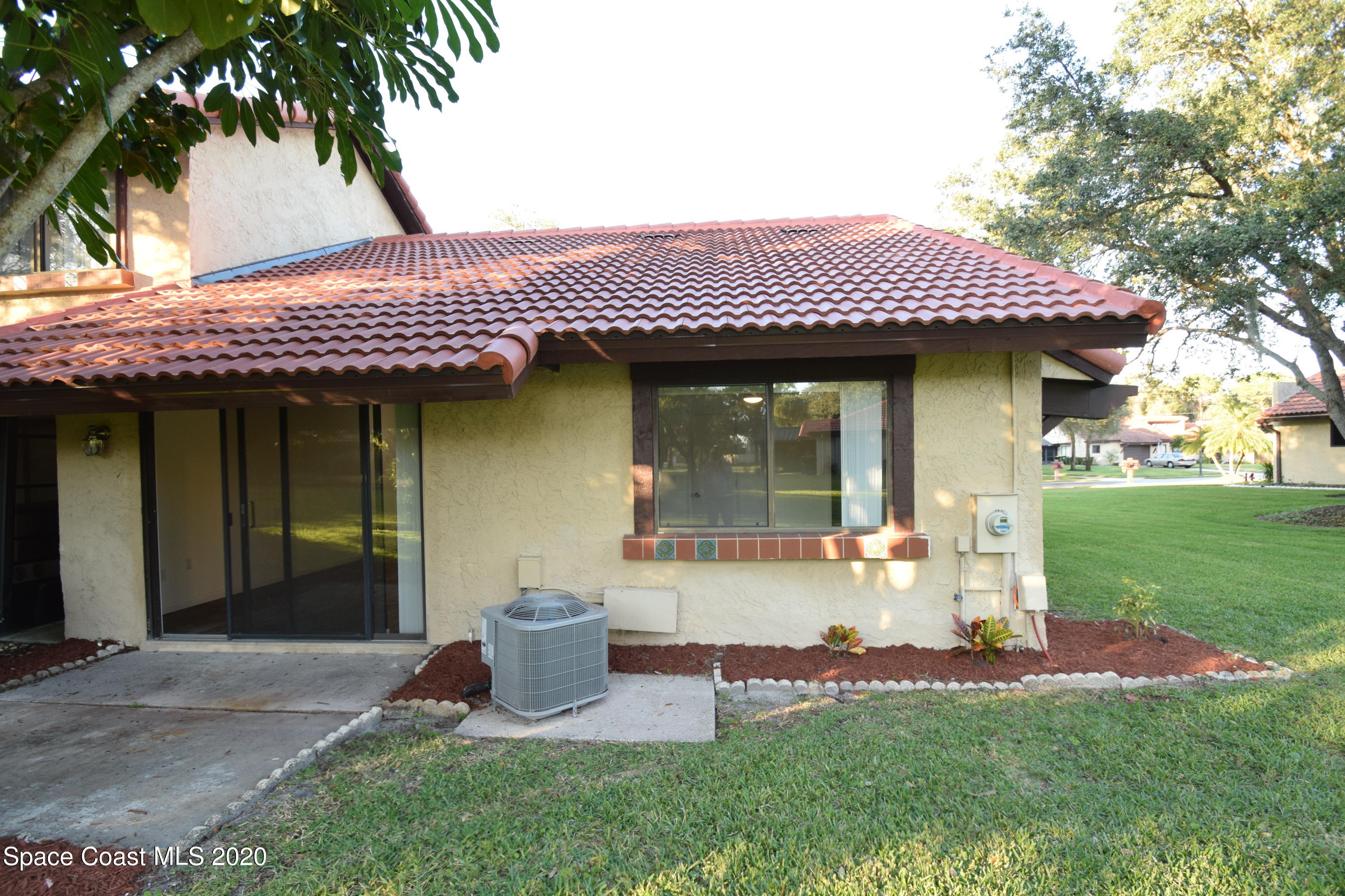 1654 Dawes Road Northeast Palm Bay, FL 32905 - Photo 37 of 47 a front view of a house with garden
