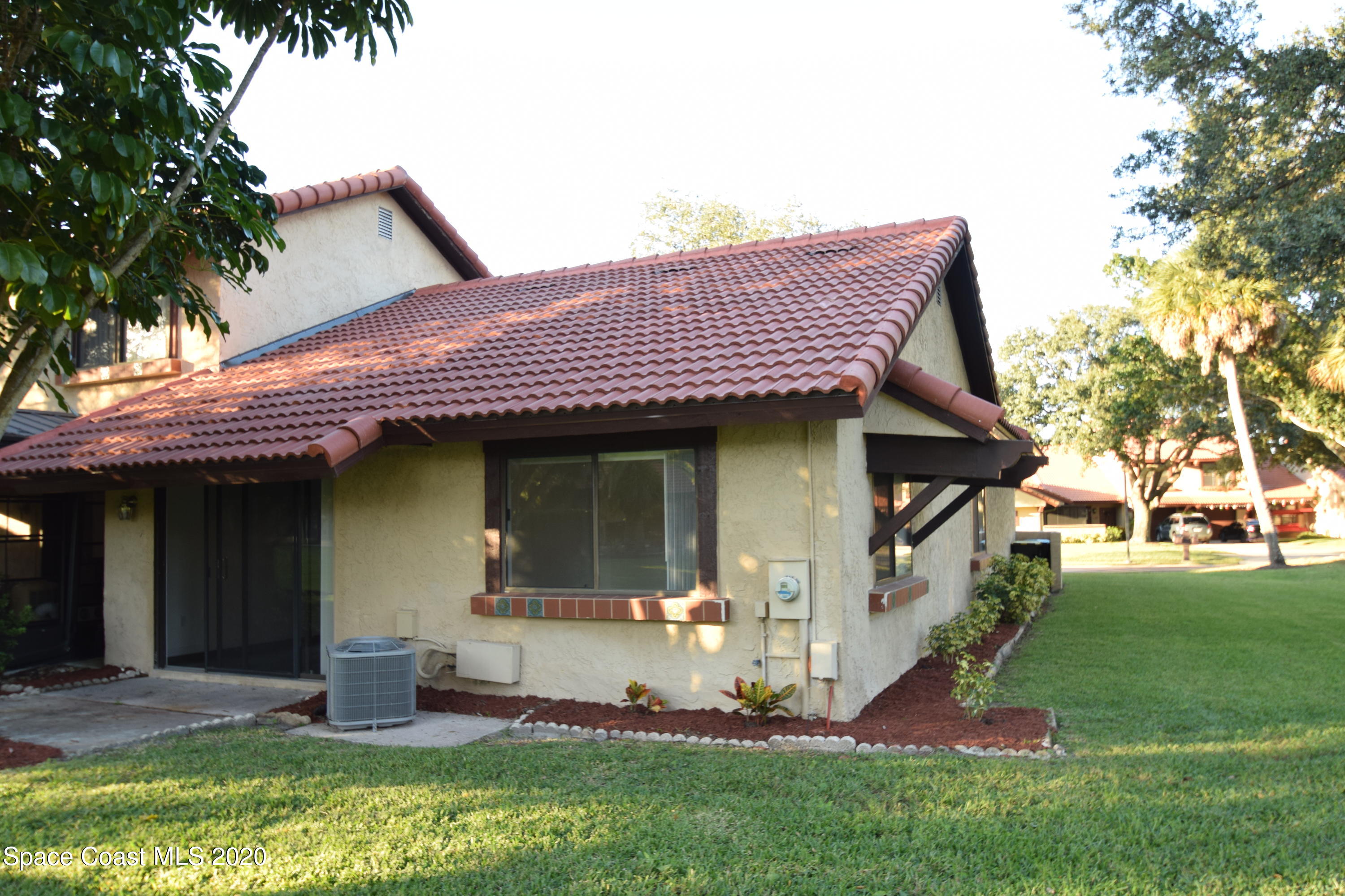 1654 Dawes Road Northeast Palm Bay, FL 32905 - Photo 39 of 47 a front view of a house with a yard