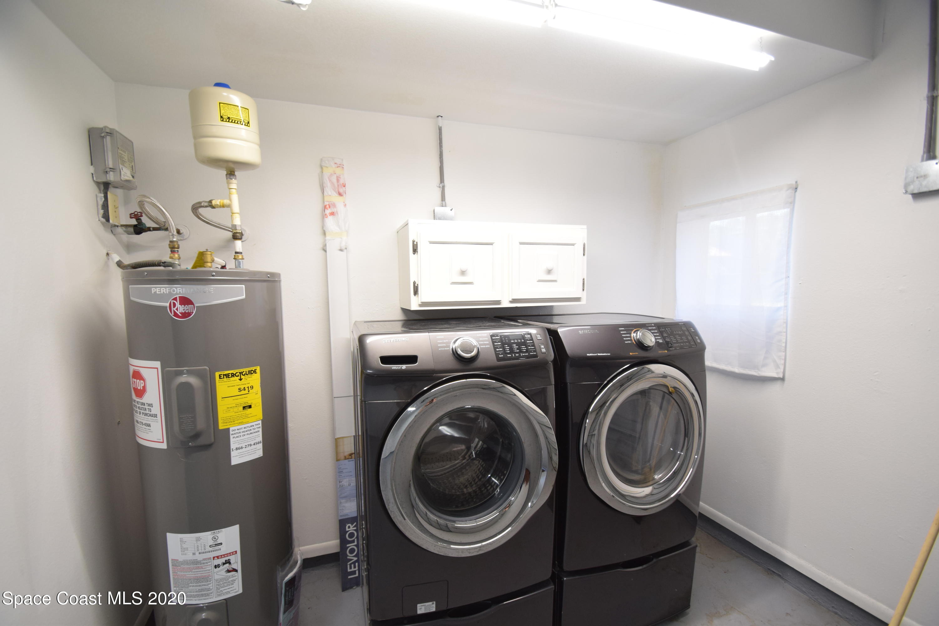 1654 Dawes Road Northeast Palm Bay, FL 32905 - Photo 42 of 47 a utility room with dryer and washer