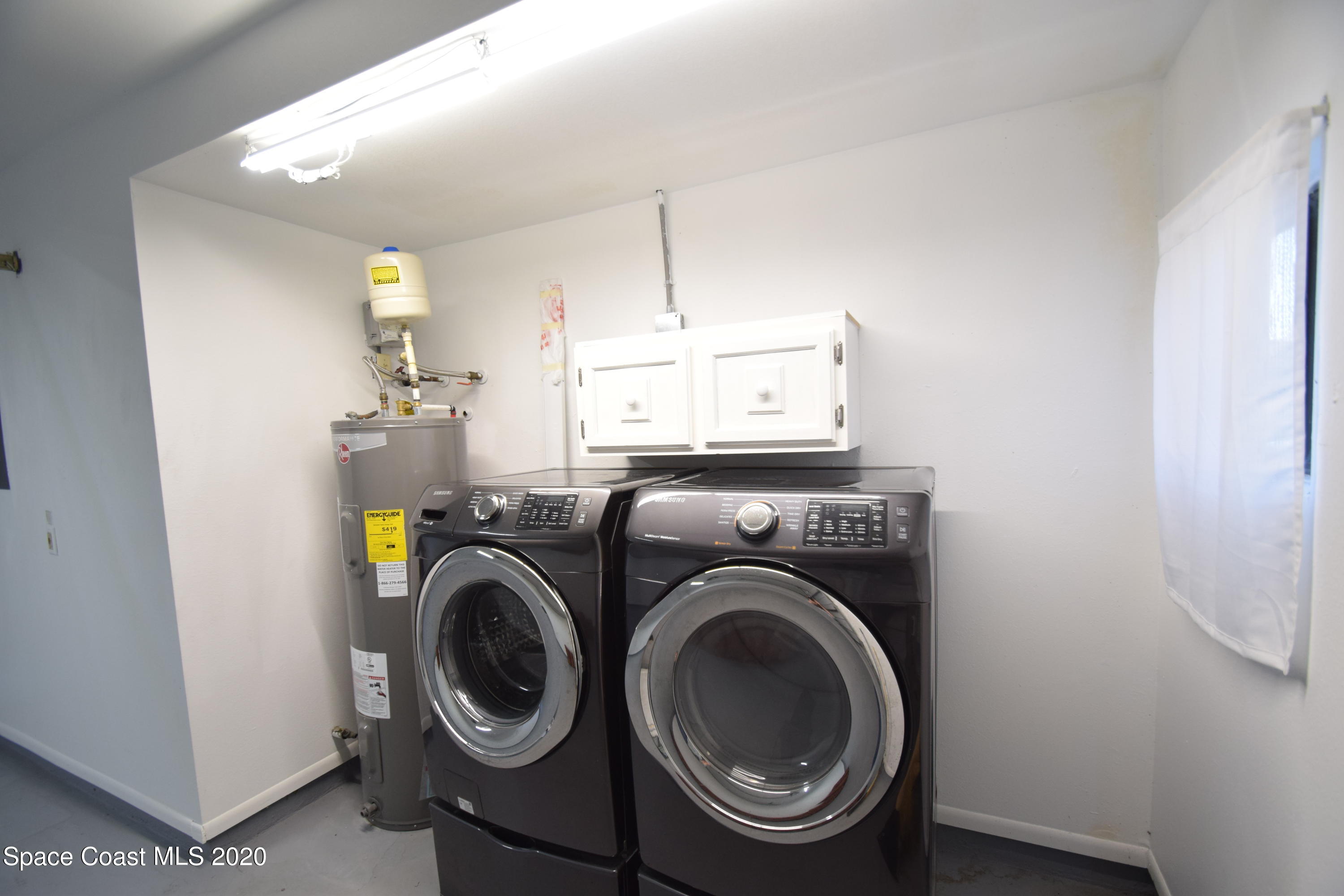 1654 Dawes Road Northeast Palm Bay, FL 32905 - Photo 43 of 47 a utility room with dryer and washer